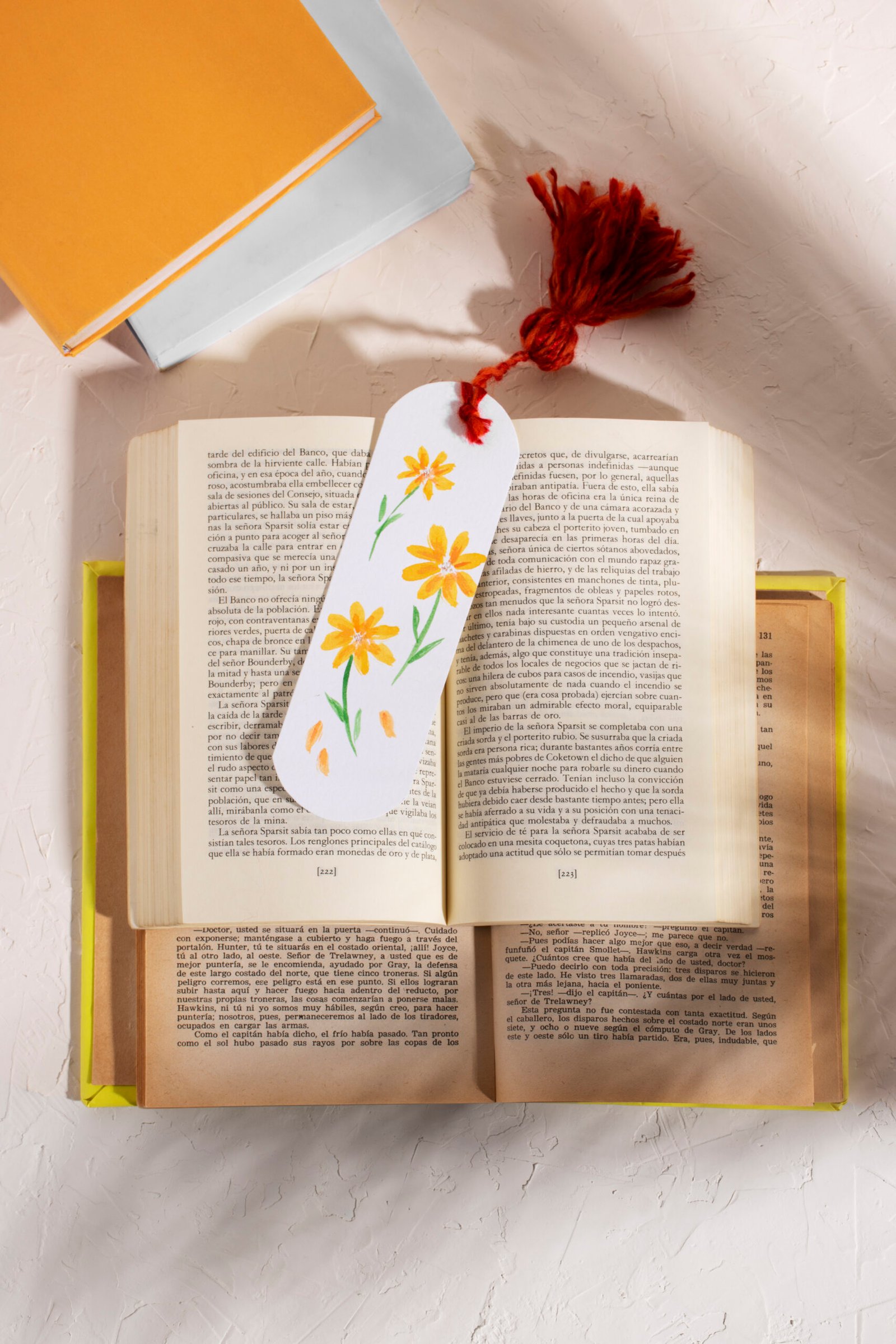 top-view-books-with-floral-bookmark